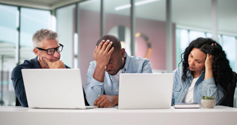 A small business team in Alexandria VA experiencing IT downtime at their workstations