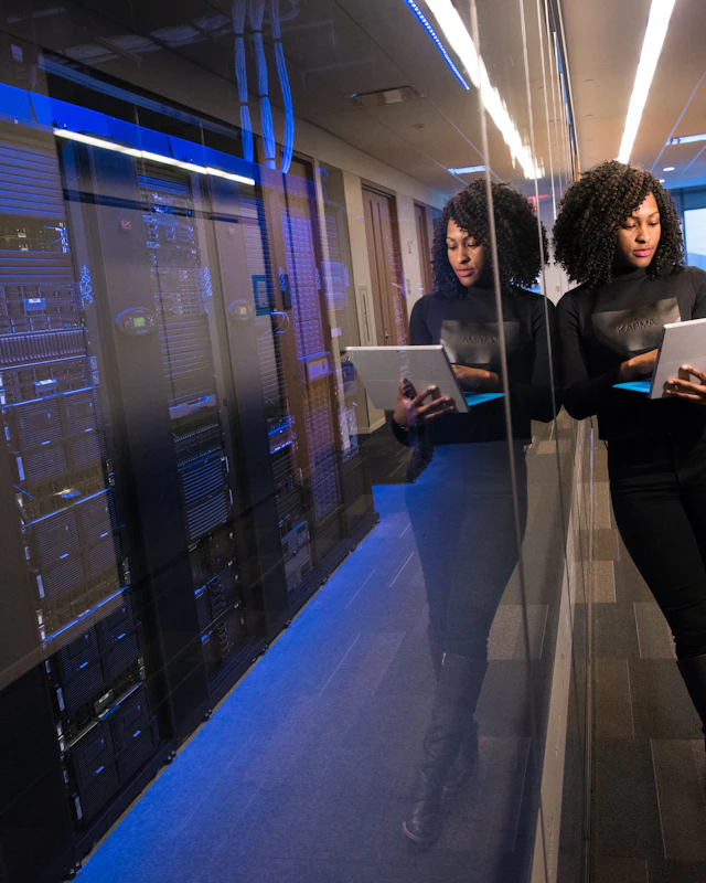 IT professional reviewing secure AI tools on a tablet in a modern office