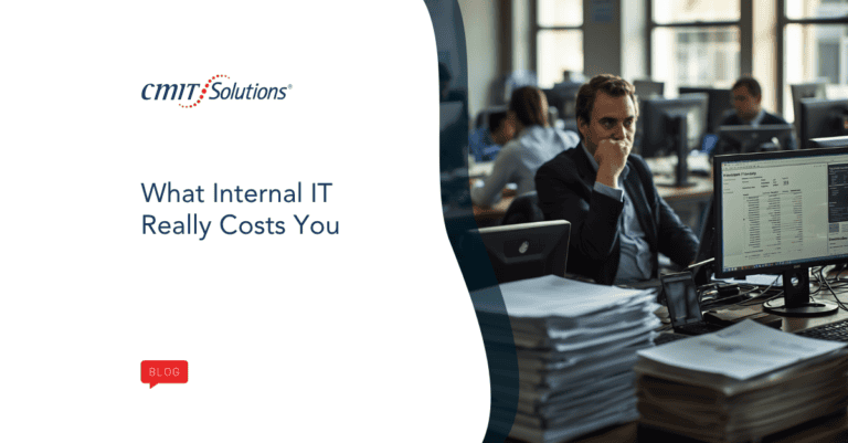 Blog hero for CMIT Solutions: 'What Internal IT Really Costs You' with an office computer setup on the right.