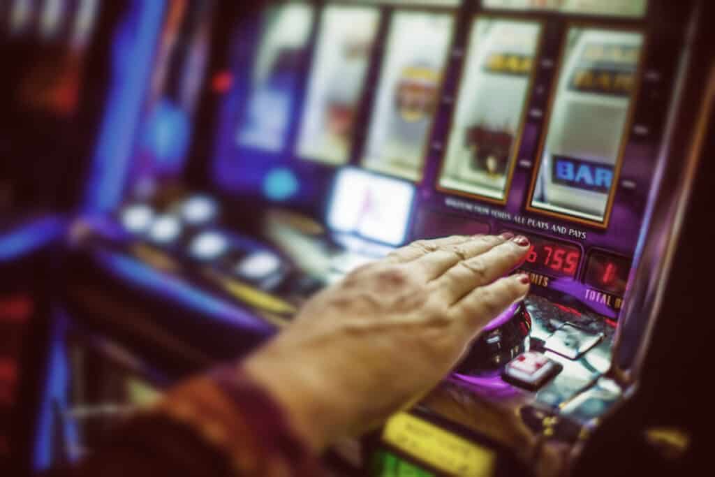Person playing a slot machine