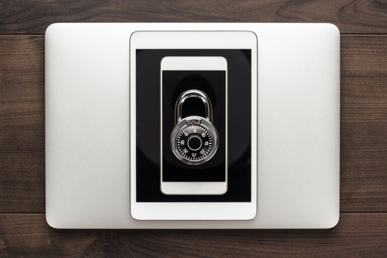 laptop tablet phone and padlock