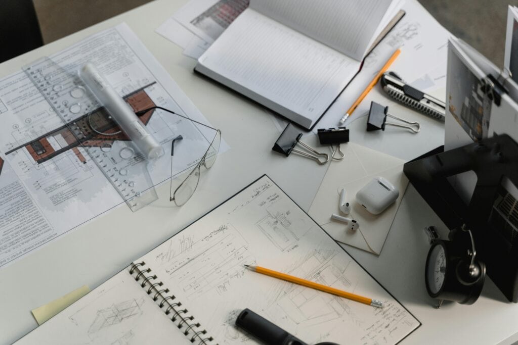 Engineering Firm with table full of work related stuff for projects