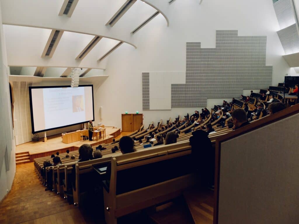 Back row view of a university lecture hall.