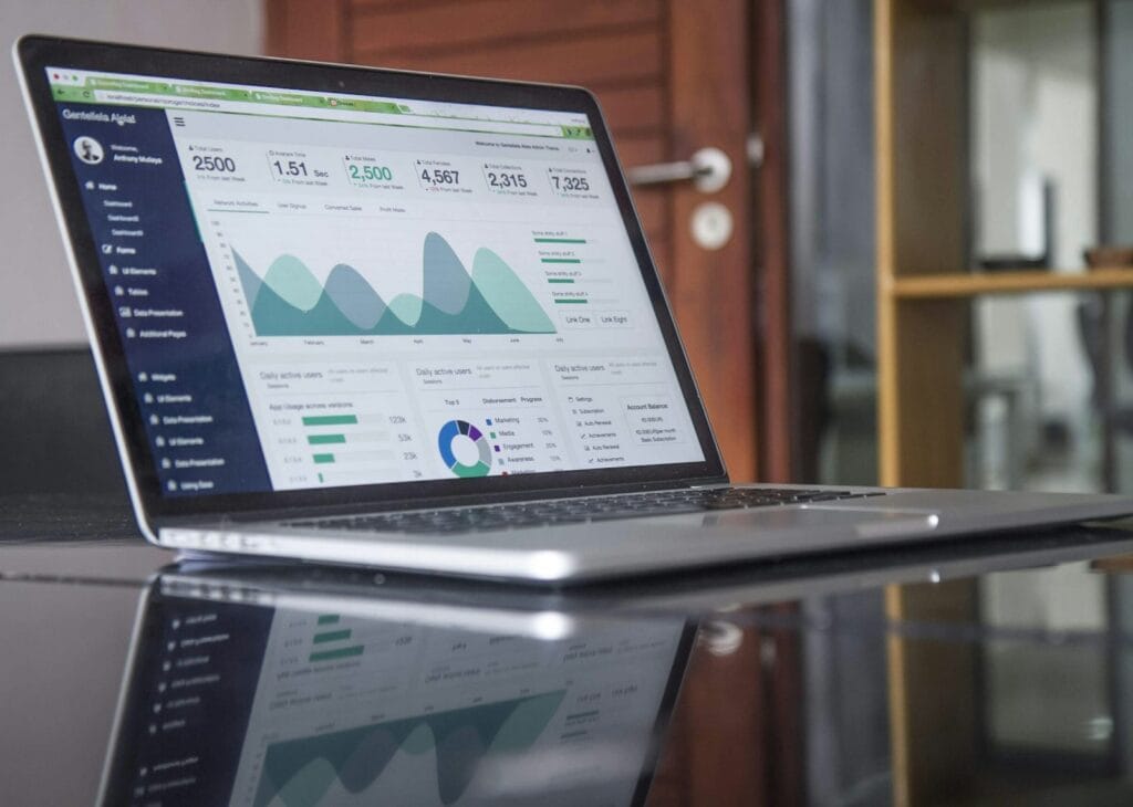 Laptop showing financial charts and reports at an accounting firm