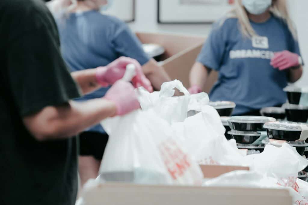 Nonprofit volunteers packing food donations