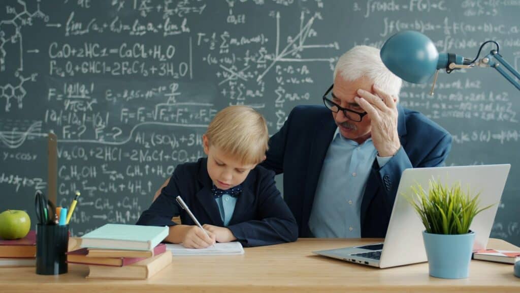 Teacher helping a young student with schoolwork