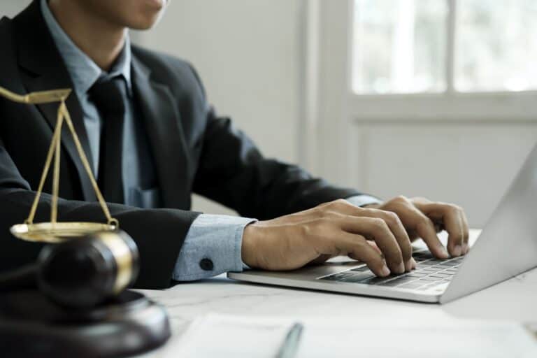 lawyer-using-laptop-in-law-office