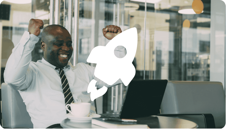 Businessperson celebrating a project launch at a desk with a laptop and coffee cup, rocket graphic indicating growth