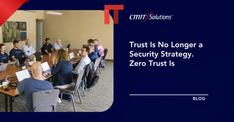 Group of professionals around a conference table with laptops; CMIT Solutions blog hero featuring the title about zero trust security.