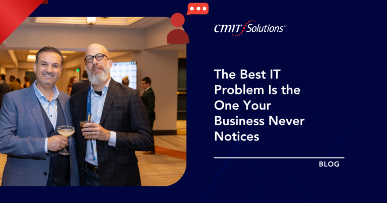 Two men in suits at a networking event, holding drinks, beside a CMIT Solutions blog hero on dark blue background.