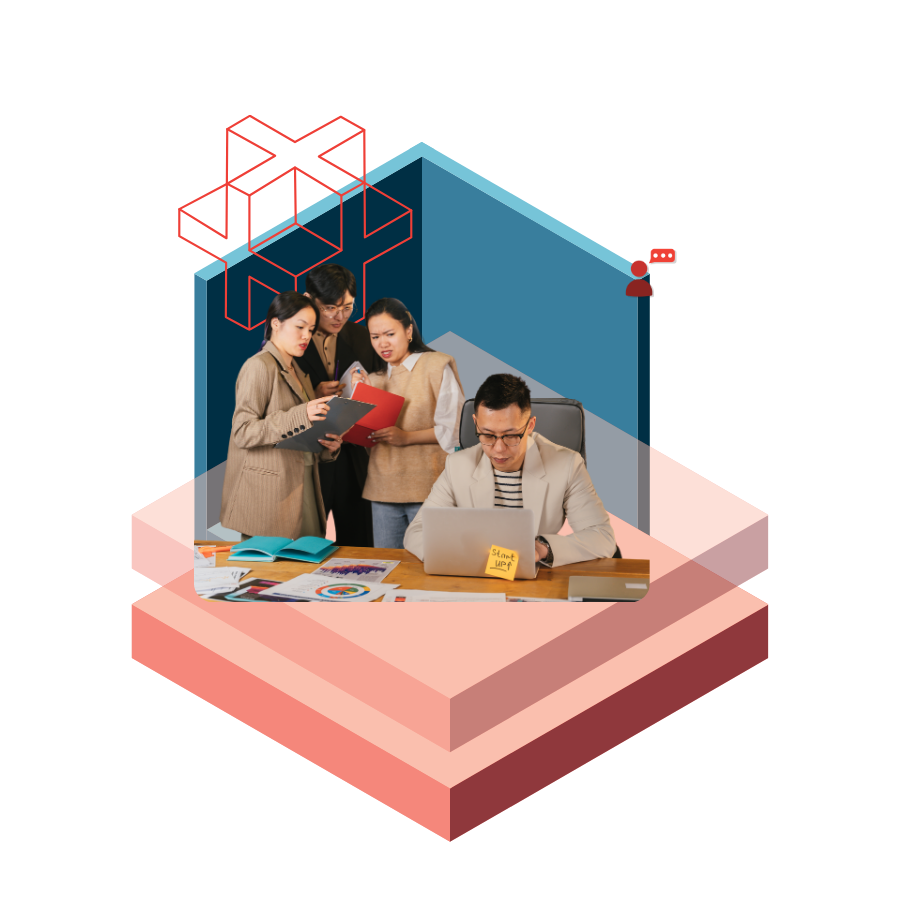 A team of four colleagues works together at a desk with a laptop and papers, set against abstract geometric backdrops indicating a collaborative workspace.