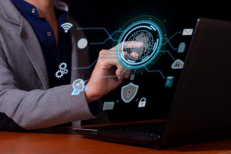 a man using cybersecurity biometrics to access his computer