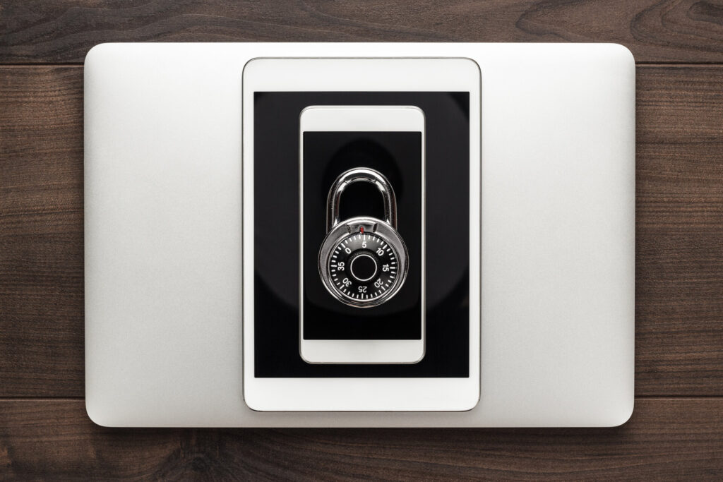 laptop tablet phone and padlock
