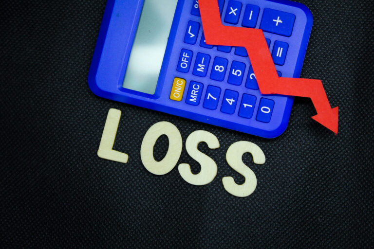 red arrow and calculator with the word loss