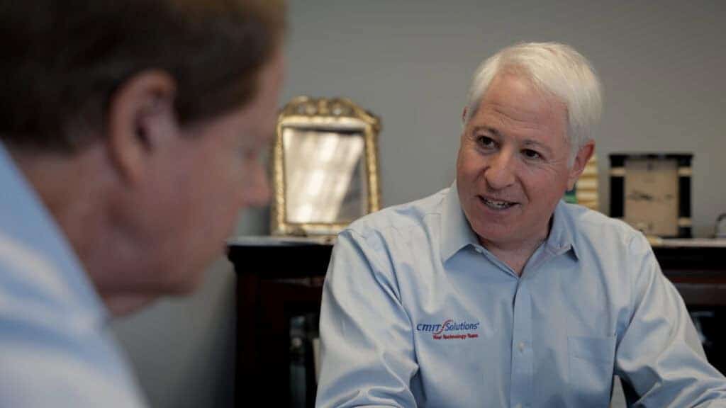 Business owner working with a CMIT technician