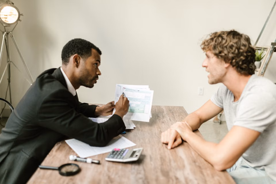 Financial advisor reviewing paperwork with a client