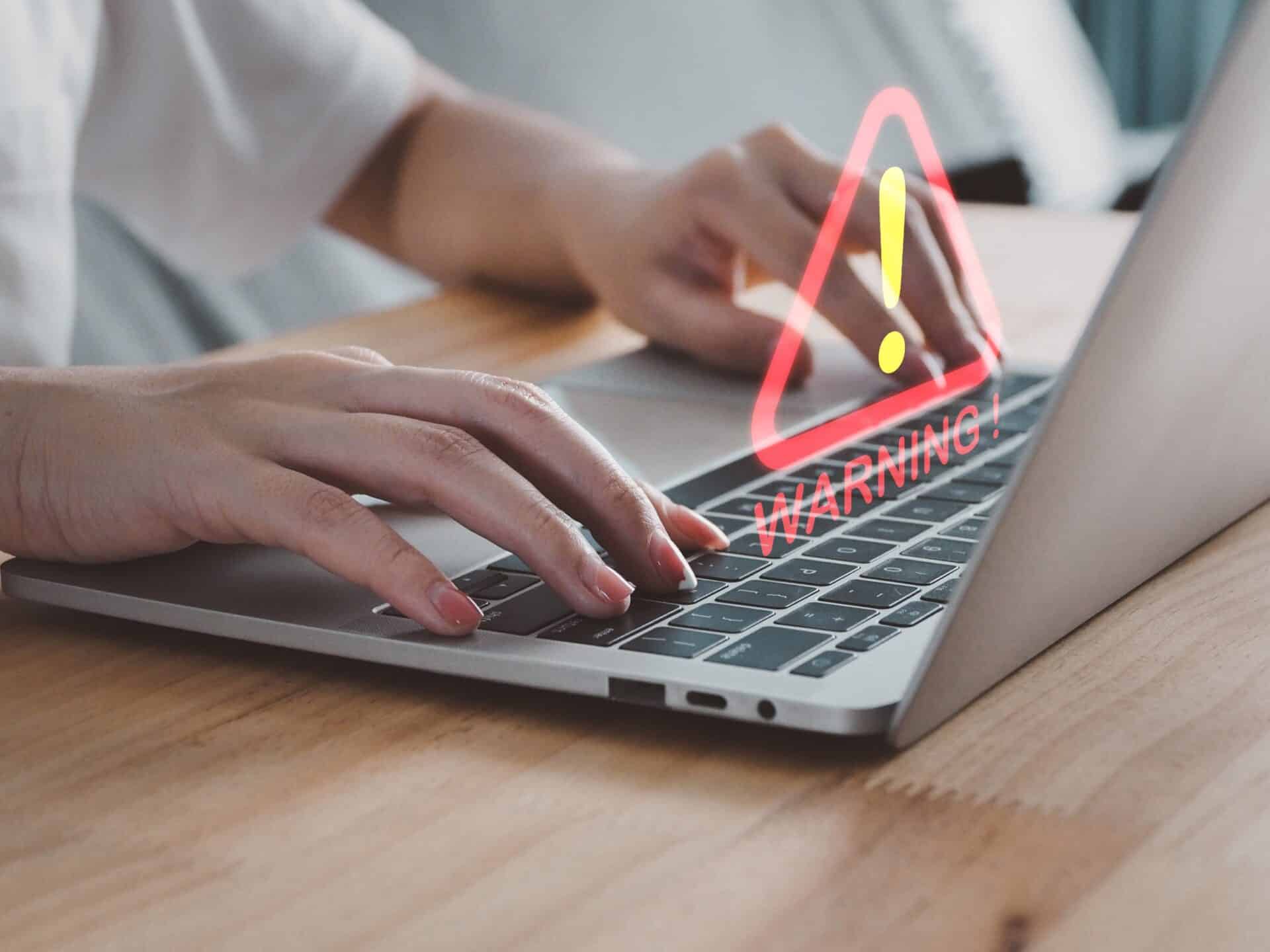 A warning appears over a company laptop during hurricane season.