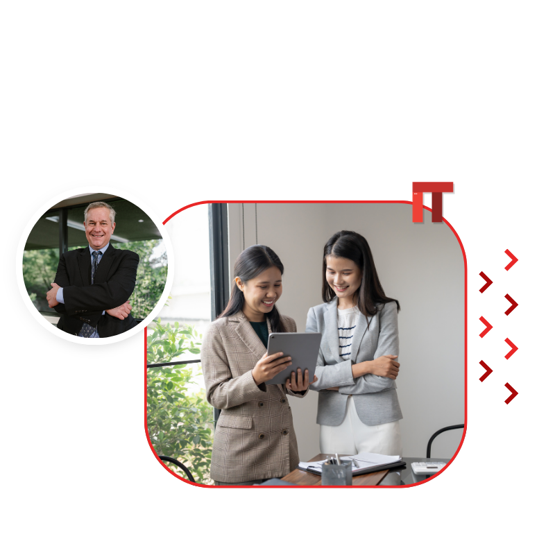 Two women in business attire review a tablet together in an office; a circular portrait of a smiling man in a suit appears on the left.