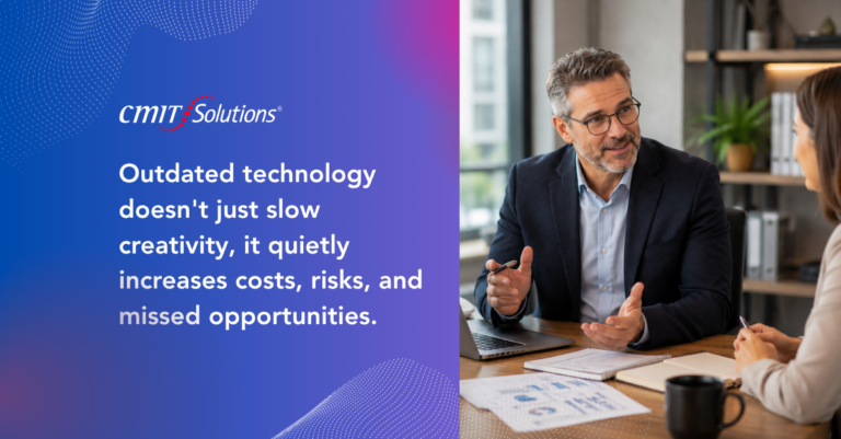 Left panel shows CMIT Solutions branding with the message: 'Outdated technology doesn't just slow creativity, it quietly increases costs, risks, and missed opportunities.' Right panel features a middle‑aged man in a dark suit discussing with a colleague at a desk, papers and a laptop nearby, in a modern office.