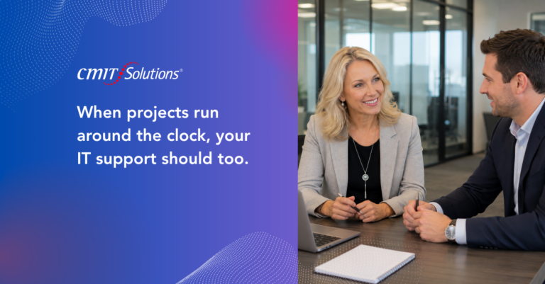 Two professionals discussing IT support in a modern office; CMIT Solutions branding on the left panel.