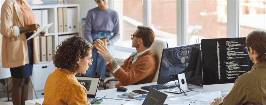 Employees in a South Denver office participating in cybersecurity awareness training session.