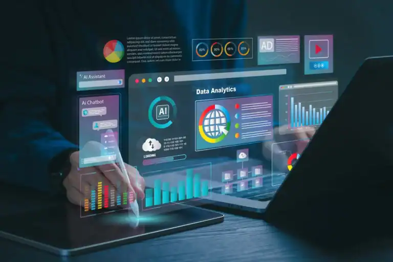 Person using a stylus on a digital tablet displaying interactive dashboard interface for AI automation for small business, with data analytics charts and chatbot widgets floating over a laptop.