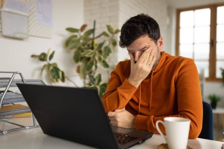 Man stressed after working at home