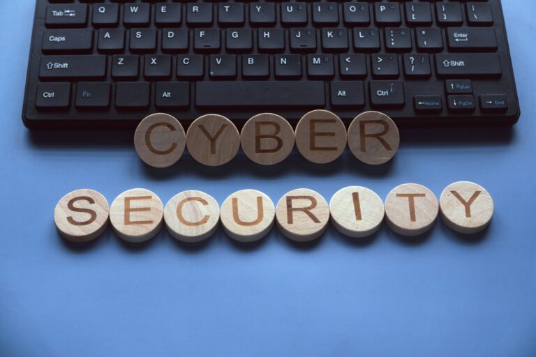 Cybersecurity text spelled out in wooden letter tiles