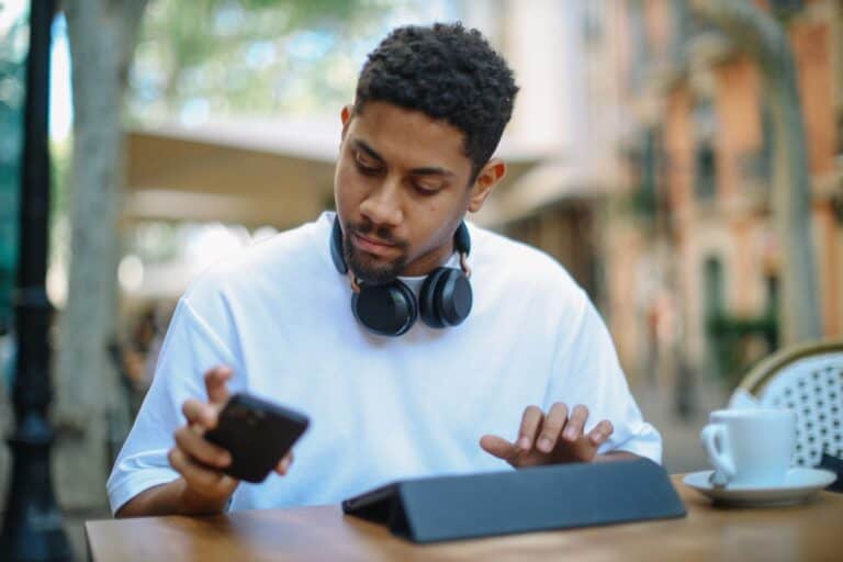 Young man checking email inbox in a cafe