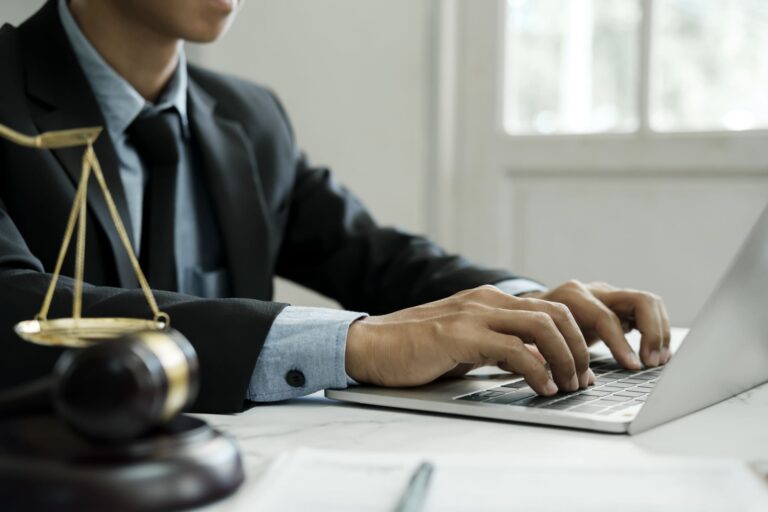lawyer-using-laptop-in-law-office