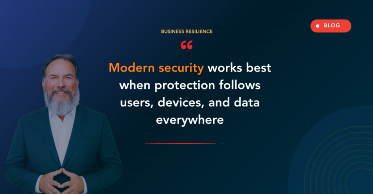 Person in teal suit on the left of a dark blue gradient hero; centered headline reads “Modern security works best when protection follows users, devices, and data everywhere,” with a BLOG badge in the top-right and a red underline under the text key line.