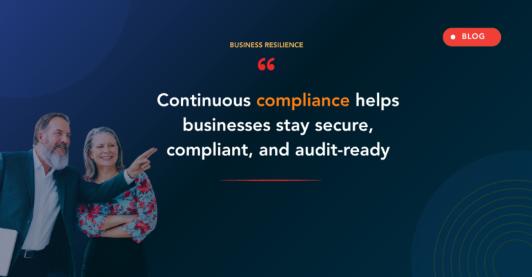 Two professionals point at a dark blue hero with the headline: 'Continuous compliance helps businesses stay secure, compliant, and audit-ready.'
