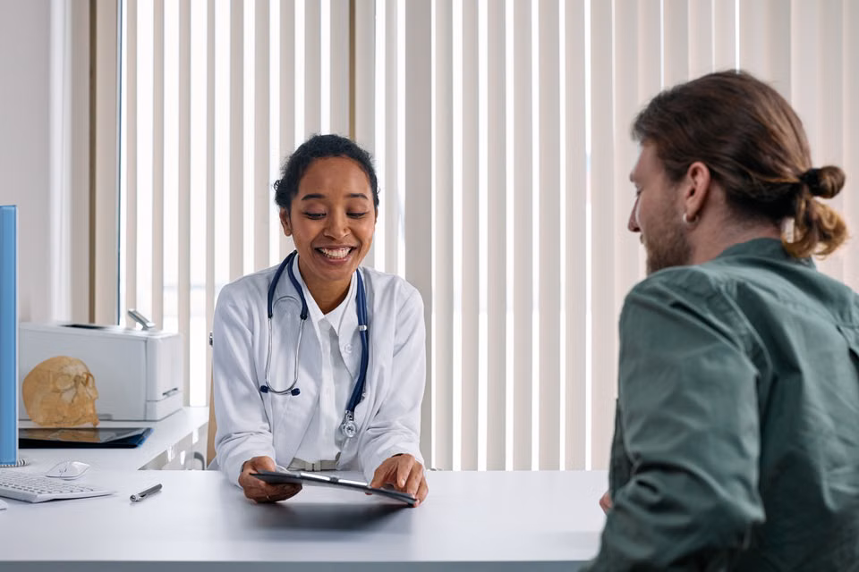 Doctor talking with a patient in a bright clinic