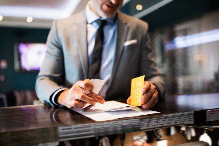 mature-businessman-at-hotel-reception
