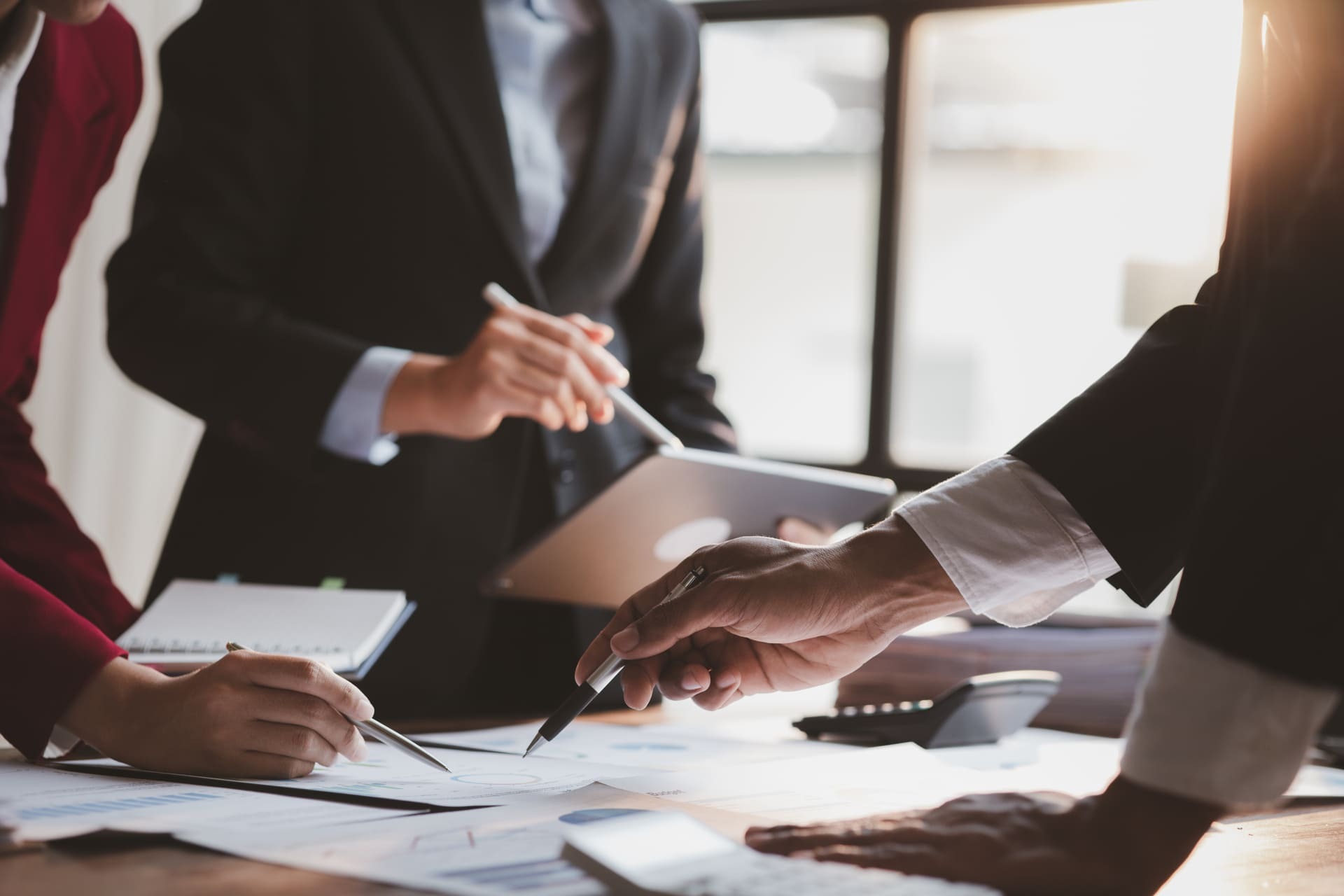 business-meeting-in-office-with-financial-charts