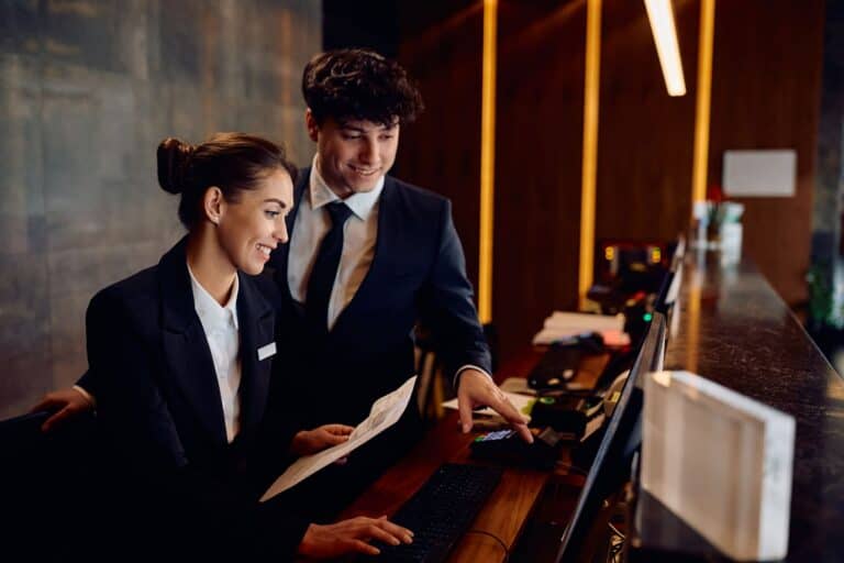 professionals-working-together-at-hotel-reception