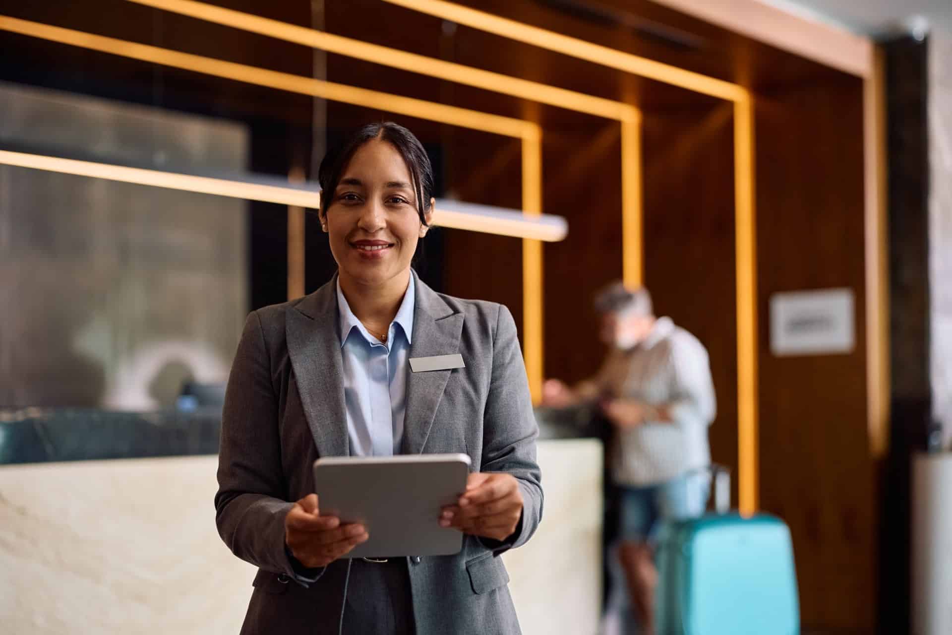 professional-female-hotel-manager-holding-tablet