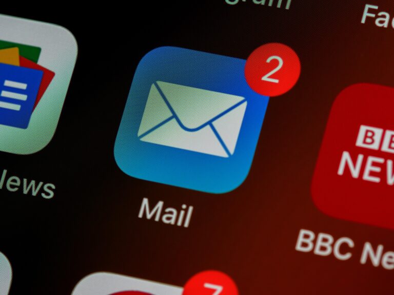 A closeup of a mail app icon with two notifications