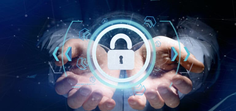 A man in a business suit holds out a glowing blue and white lock that depicts cybersecurity.