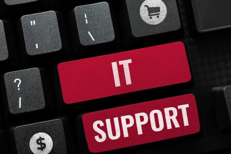 The word “IT Support” written on a keyboard.