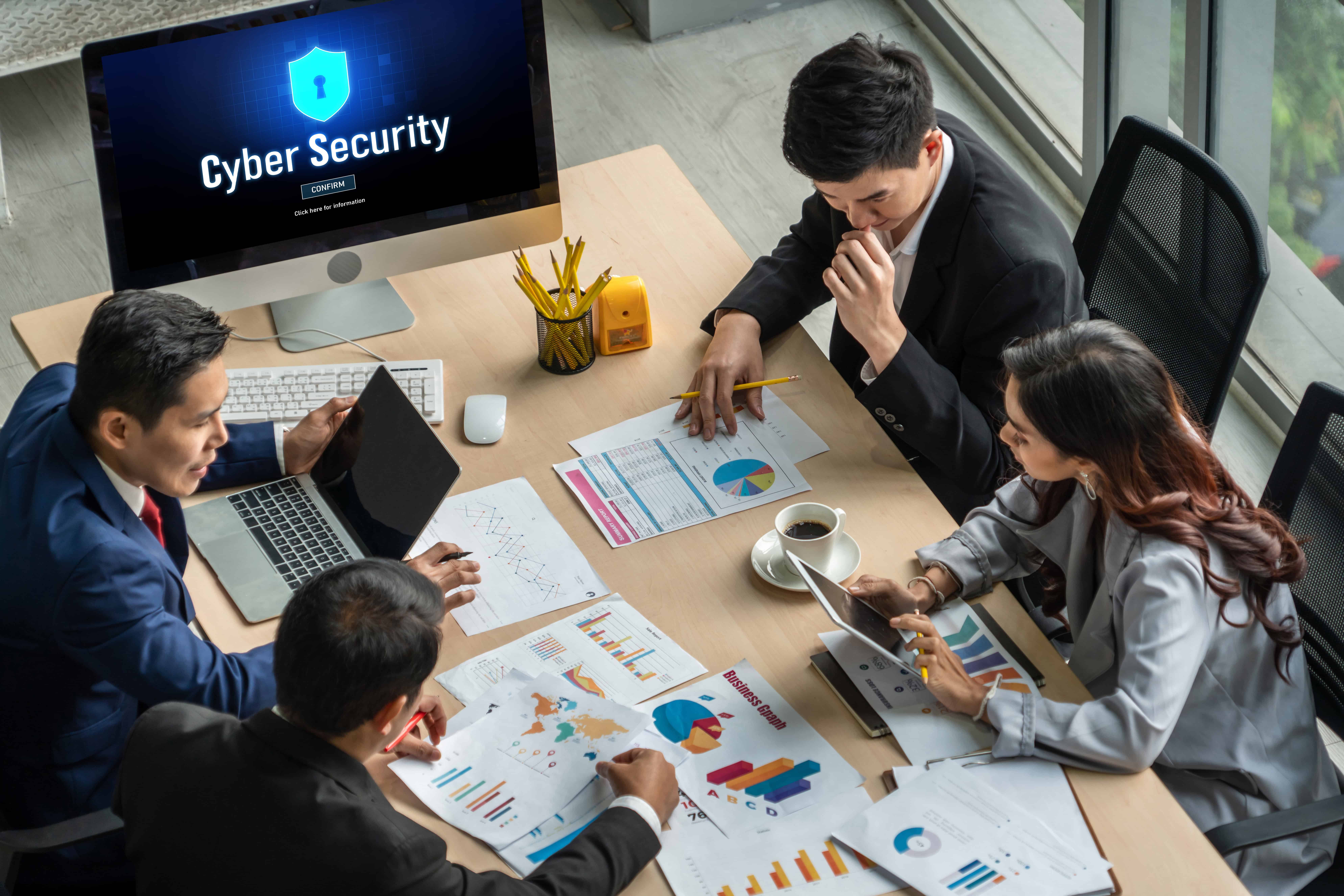 A managed service team showcases cybersecurity plans to a small business owner.