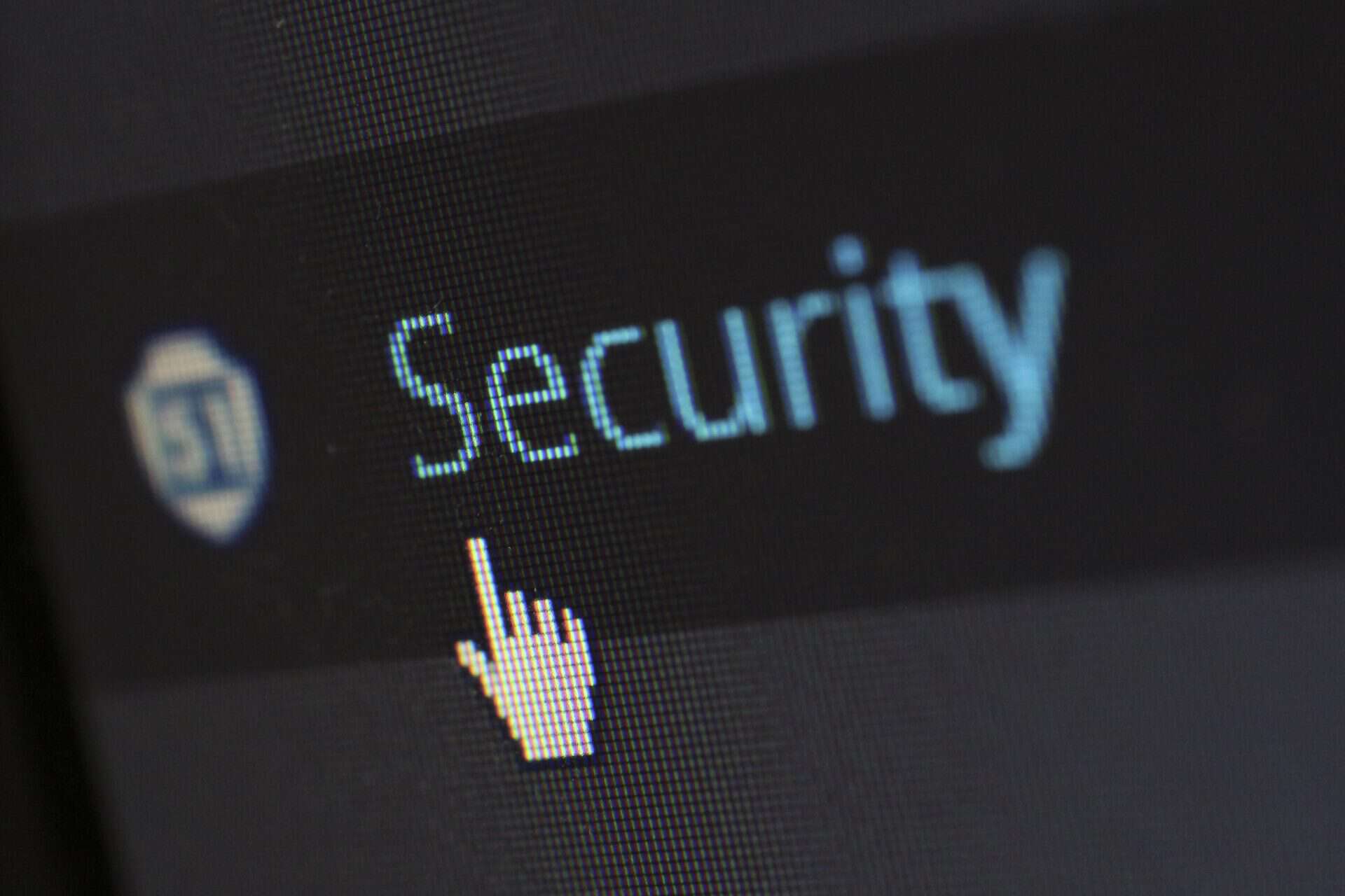 A closeup of a computer screen shows a cursor hovering over the linked word security.