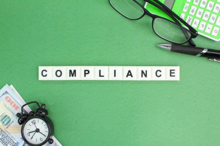 compliance-calculator-glasses-money-deadline-concept