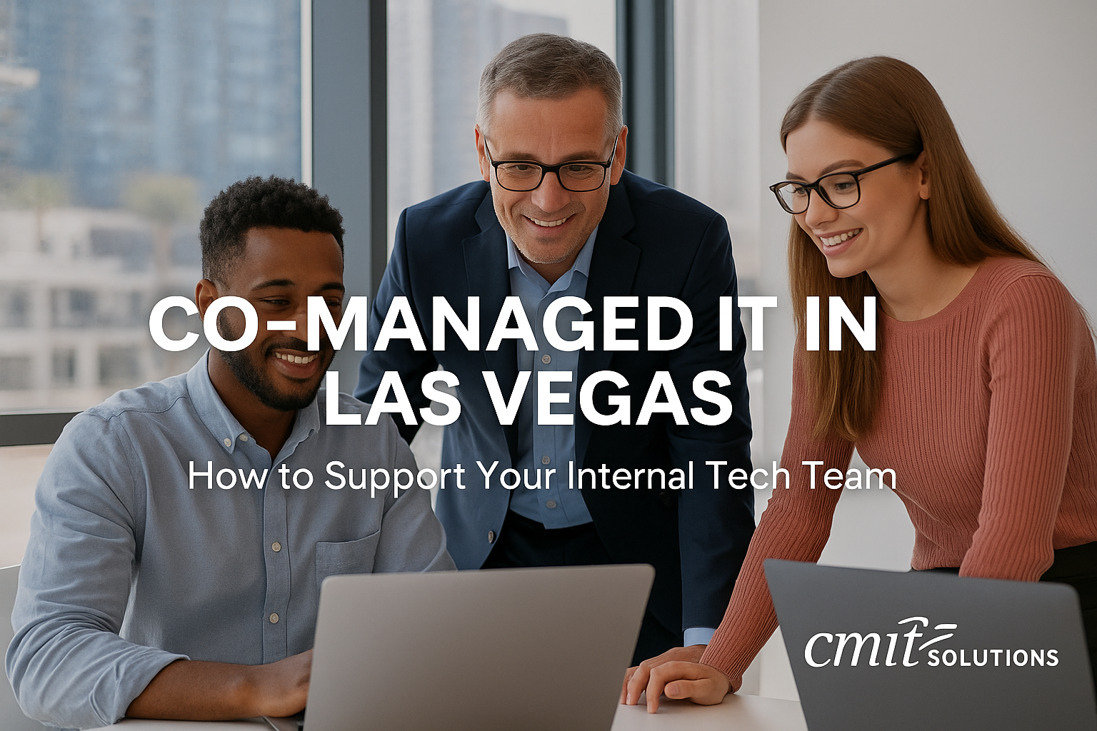 IT professionals collaborating in a Las Vegas office representing co-managed IT support services by CMIT Solutions