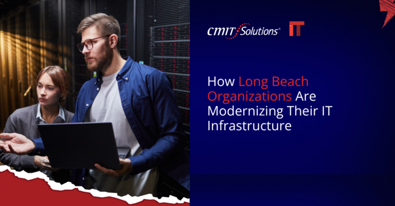 Two IT professionals review a laptop in a server room; blue CMIT Solutions banner shows the headline about IT infrastructure modernization.