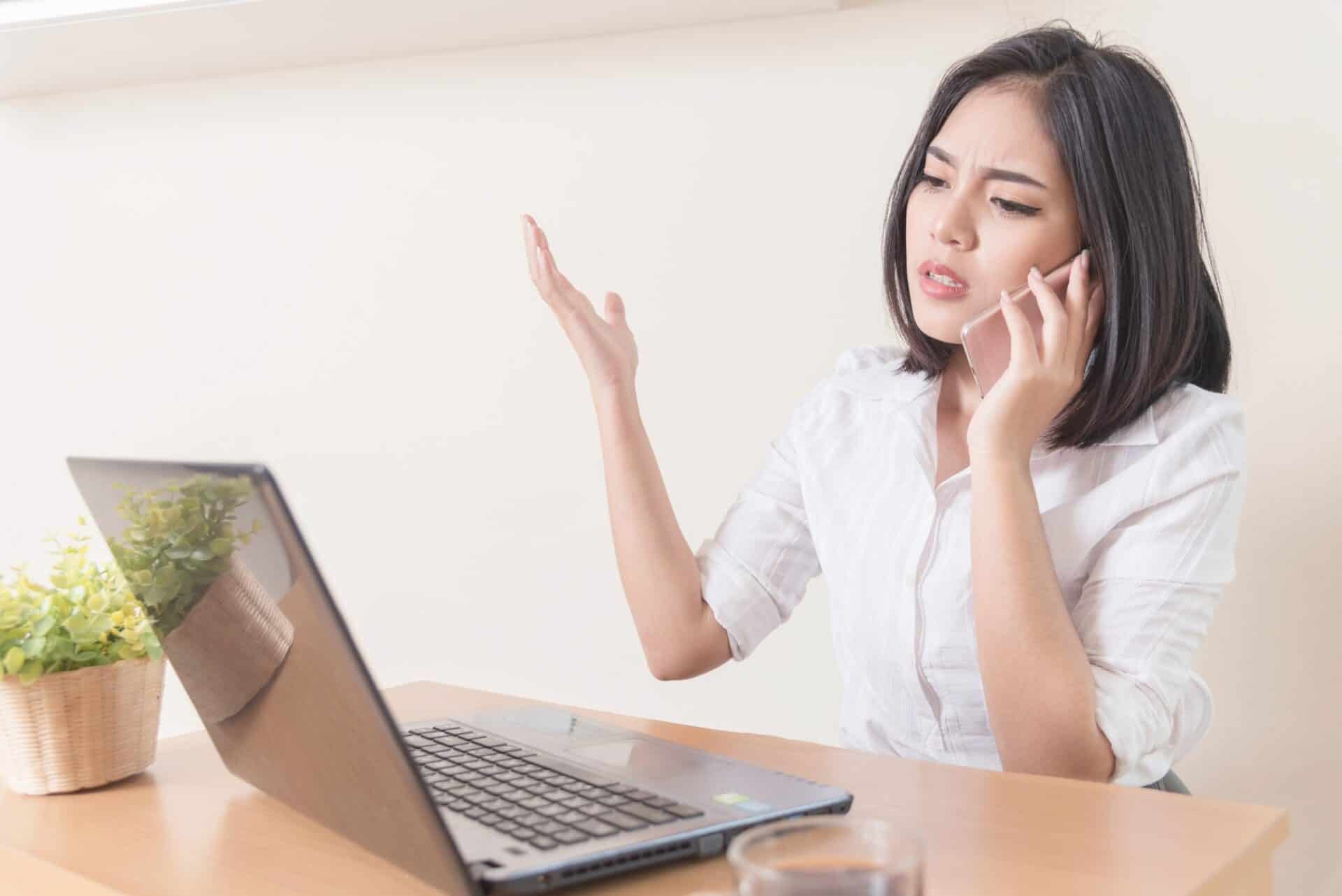 Business woman frustrated with her computer