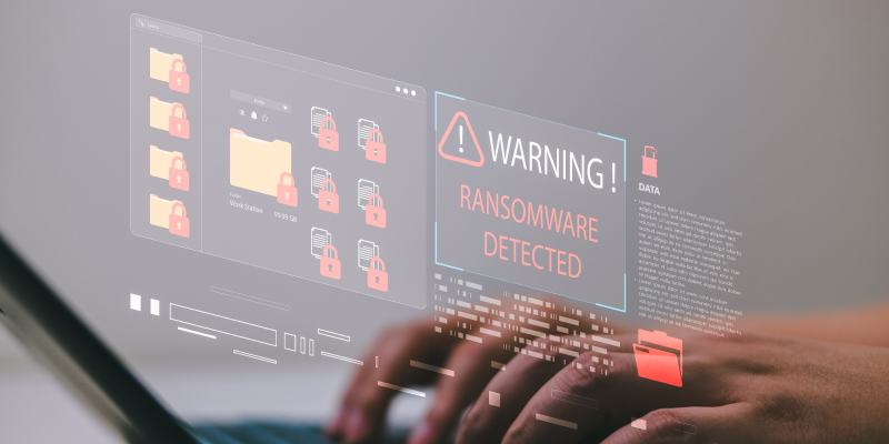 Computer screen showing a pop-up alert box warning of ransomware detection.
