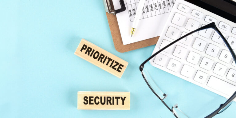 Prioritize security wooden blocks illustrating the need to avoid the real cost of reactive security for Mesa businesses.