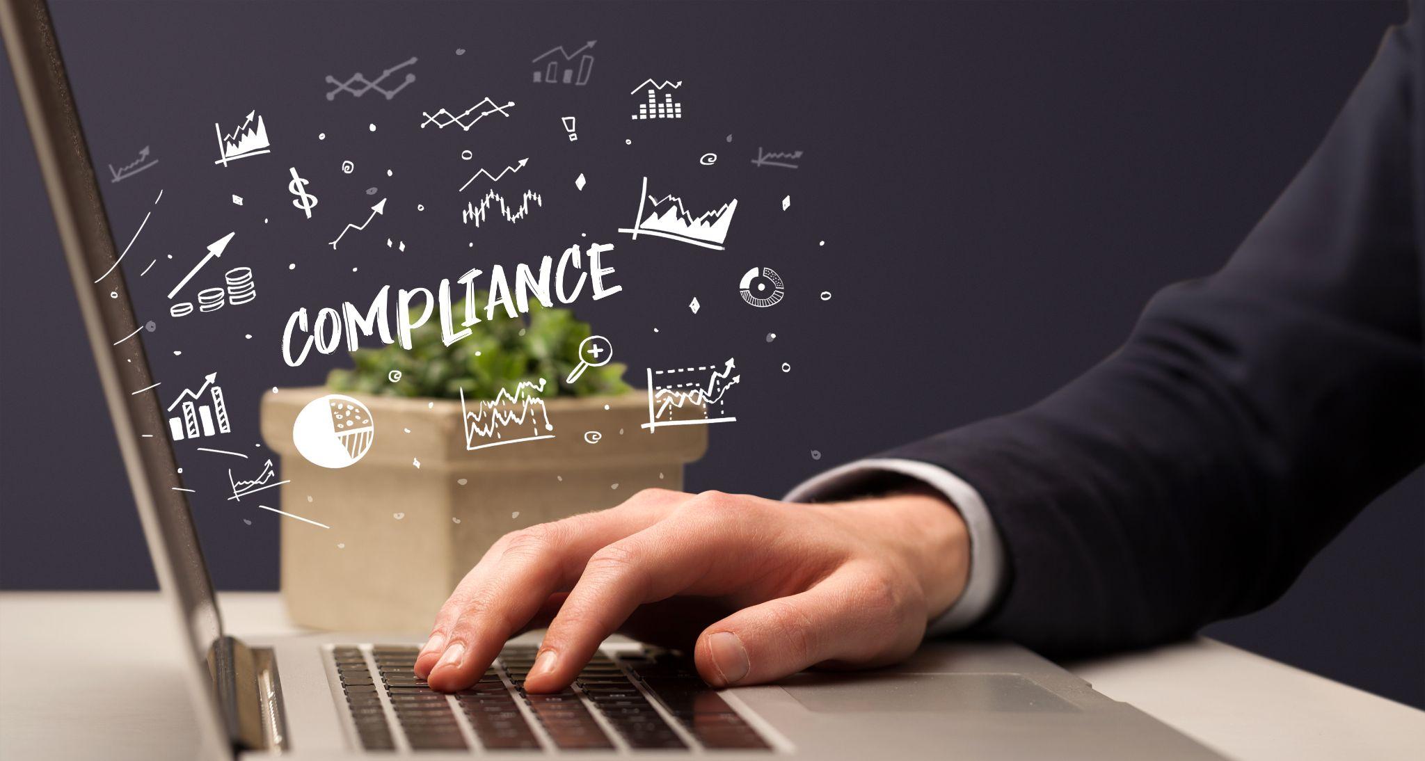 Business professional ensuring IT compliance through managed services on a laptop