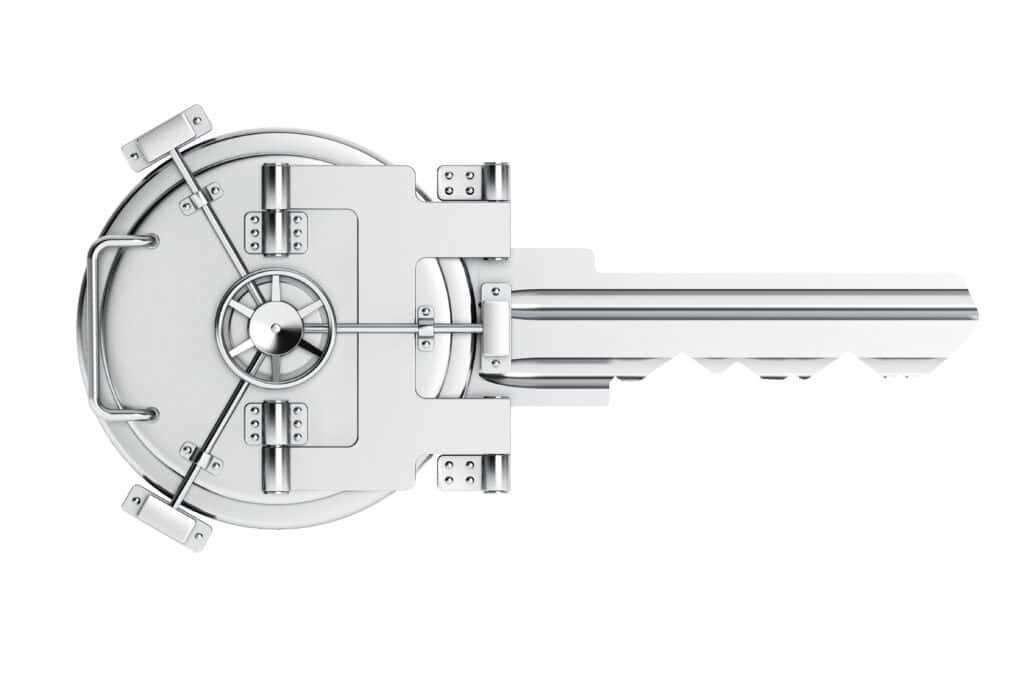 A silver key as a vault bank door on a white background. 